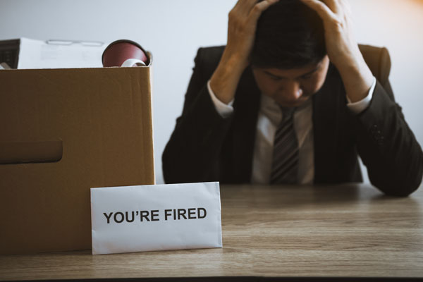 Male employee is stressed or angry while he is fired from being an employee of the company.