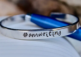Hashtag AmWriting, Gift for Writers. These inspirational cuffs are hand stamped with love and polished to a beautiful shine. They're adjustable and made of sturdy aluminum, which is lightweight but strong. They're also perfect for stacking!